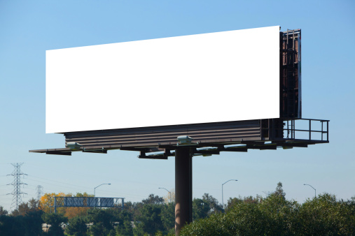 Blank billboard against blue sky