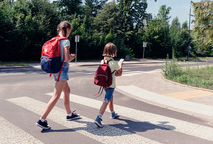 children crossing crosswalk
